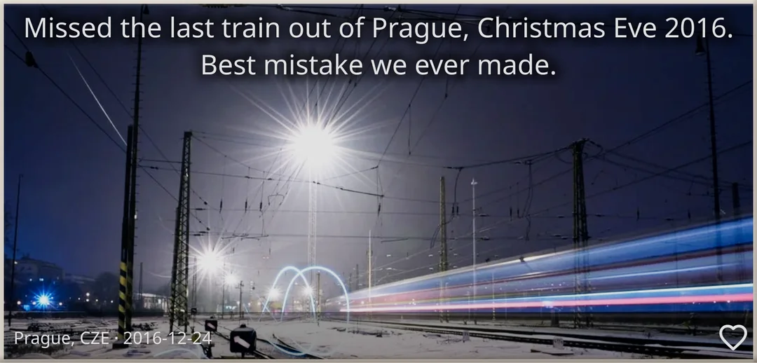 A brick with a snowy railway at night and a train streaking past: “Missed the last train out of Prague, Christmas Eve 2016. Best mistake we ever made.”