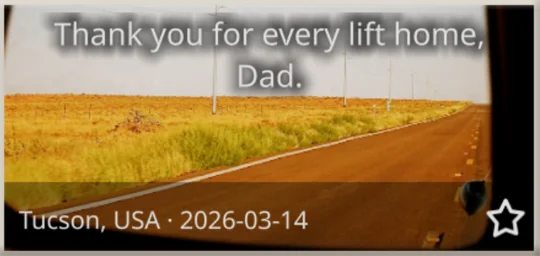 An empty road in a car’s side mirror: “Thank you for every lift home, Dad.”